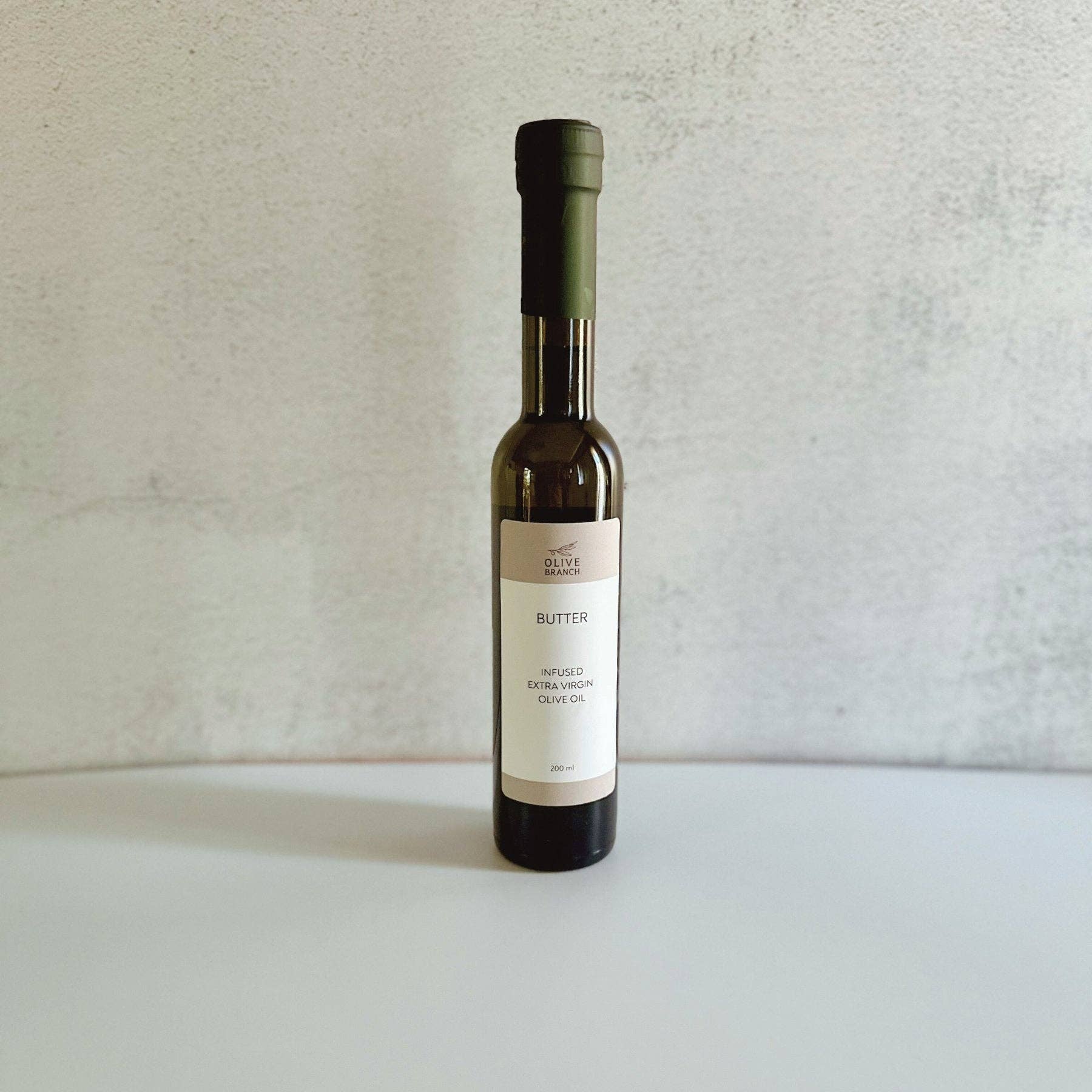 Arbequina Spanish EVOO from Olive Branch — single origin, unfiltered, first pressed, 200ml. Village Cobblery, Gualala CA.