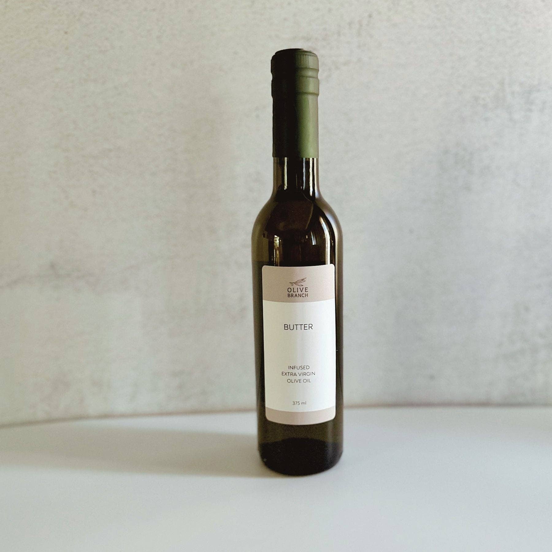 Arbequina Spanish EVOO from Olive Branch — single origin, unfiltered, first pressed, 200ml. Village Cobblery, Gualala CA.